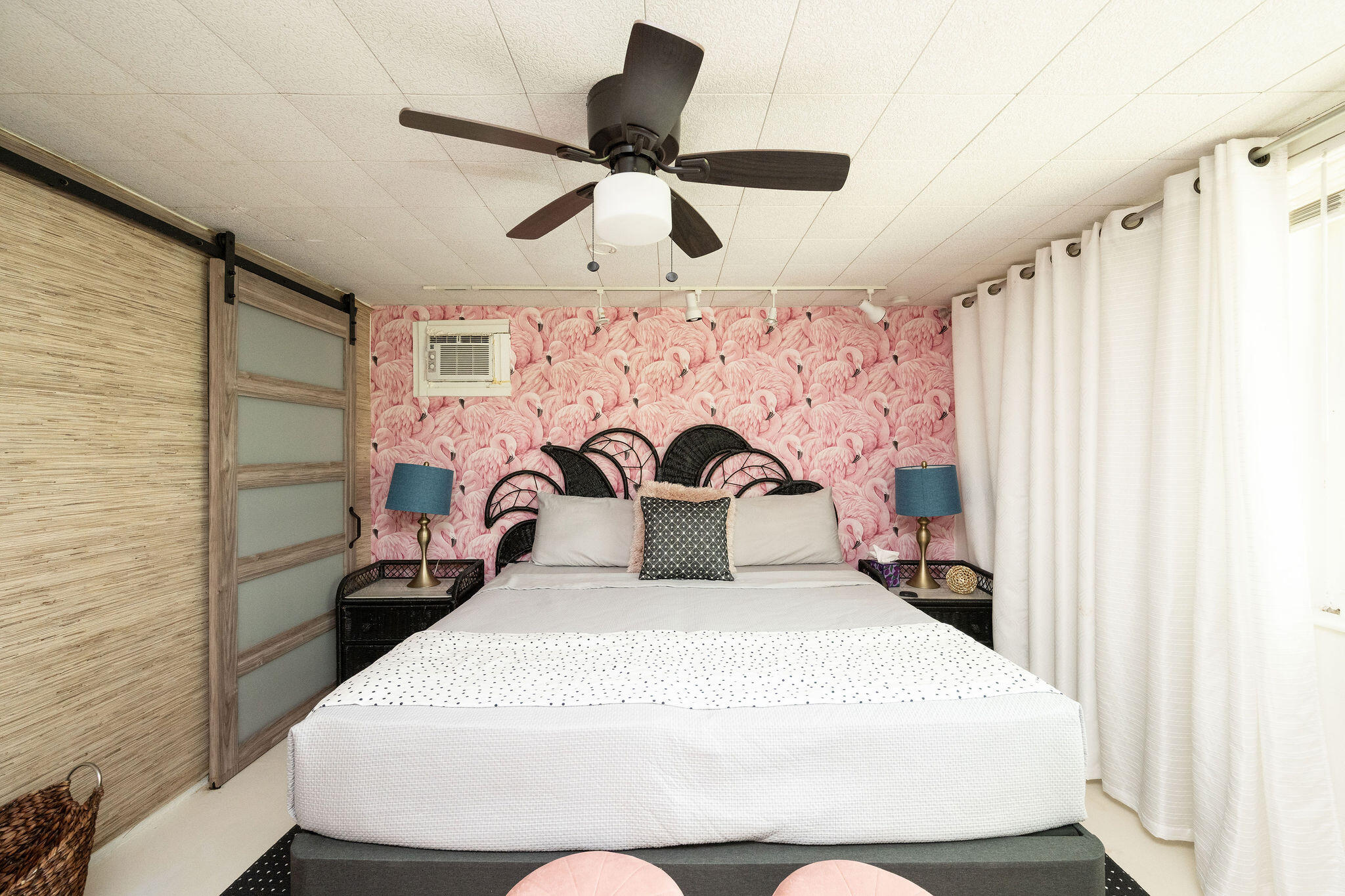 78 Bay Drive Key West, FL 33040 - Photo 84 of 116 a bedroom with a bed and a chandelier