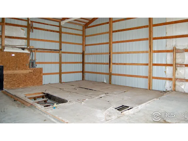 a black and white photo of a bedroom