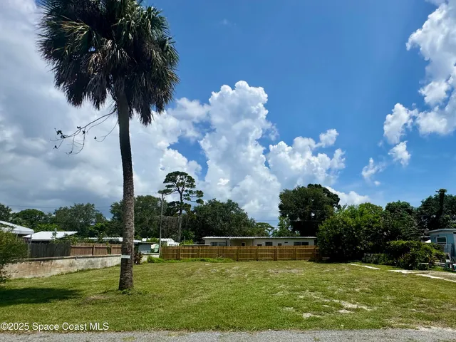 a view of a golf course with a lake