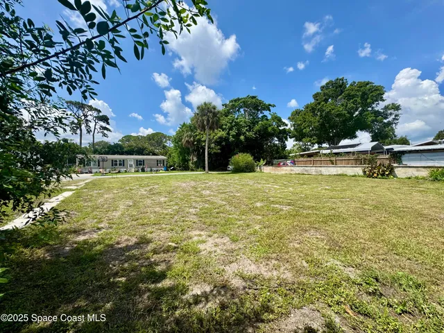 a view of a swimming pool with an outdoor space and seating area