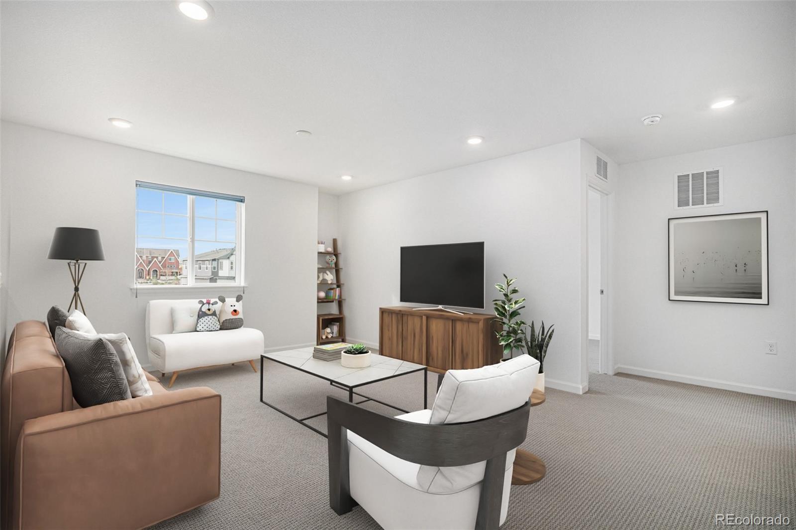 18235 Caffey Drive Parker, CO 80134 - Photo 21 of 38 a living room with furniture and a flat screen tv