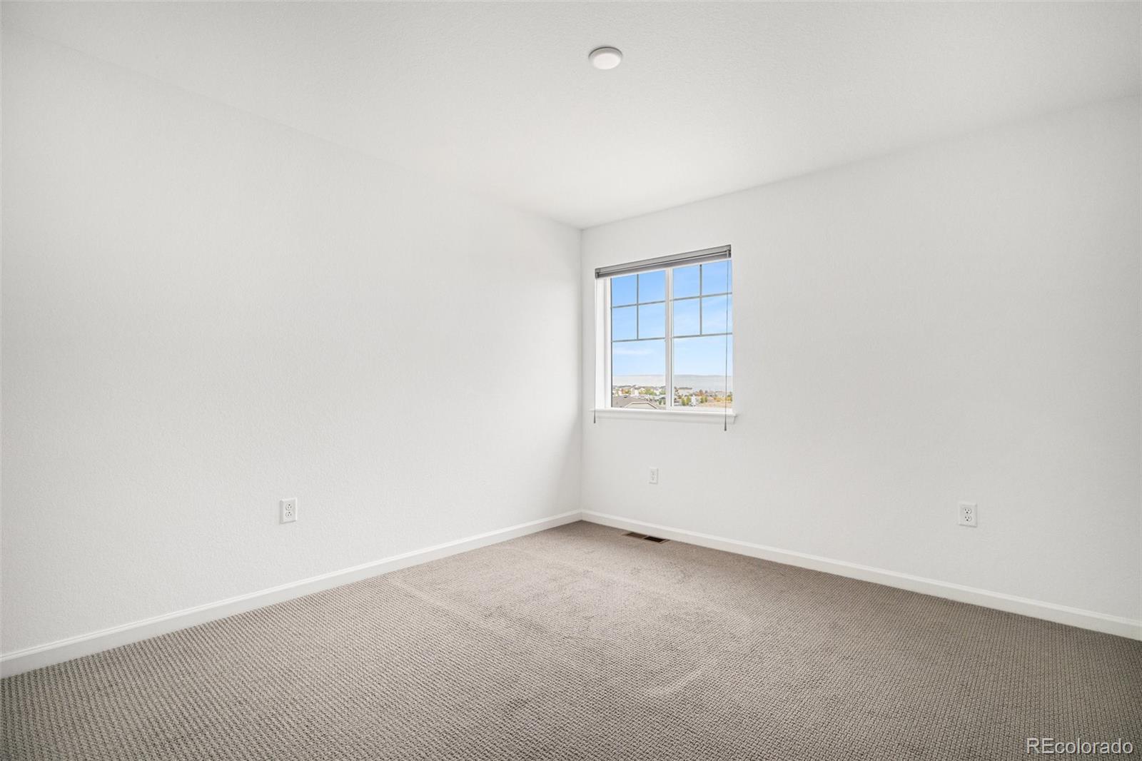 18235 Caffey Drive Parker, CO 80134 - Photo 27 of 38 an empty room with a empty space and a window