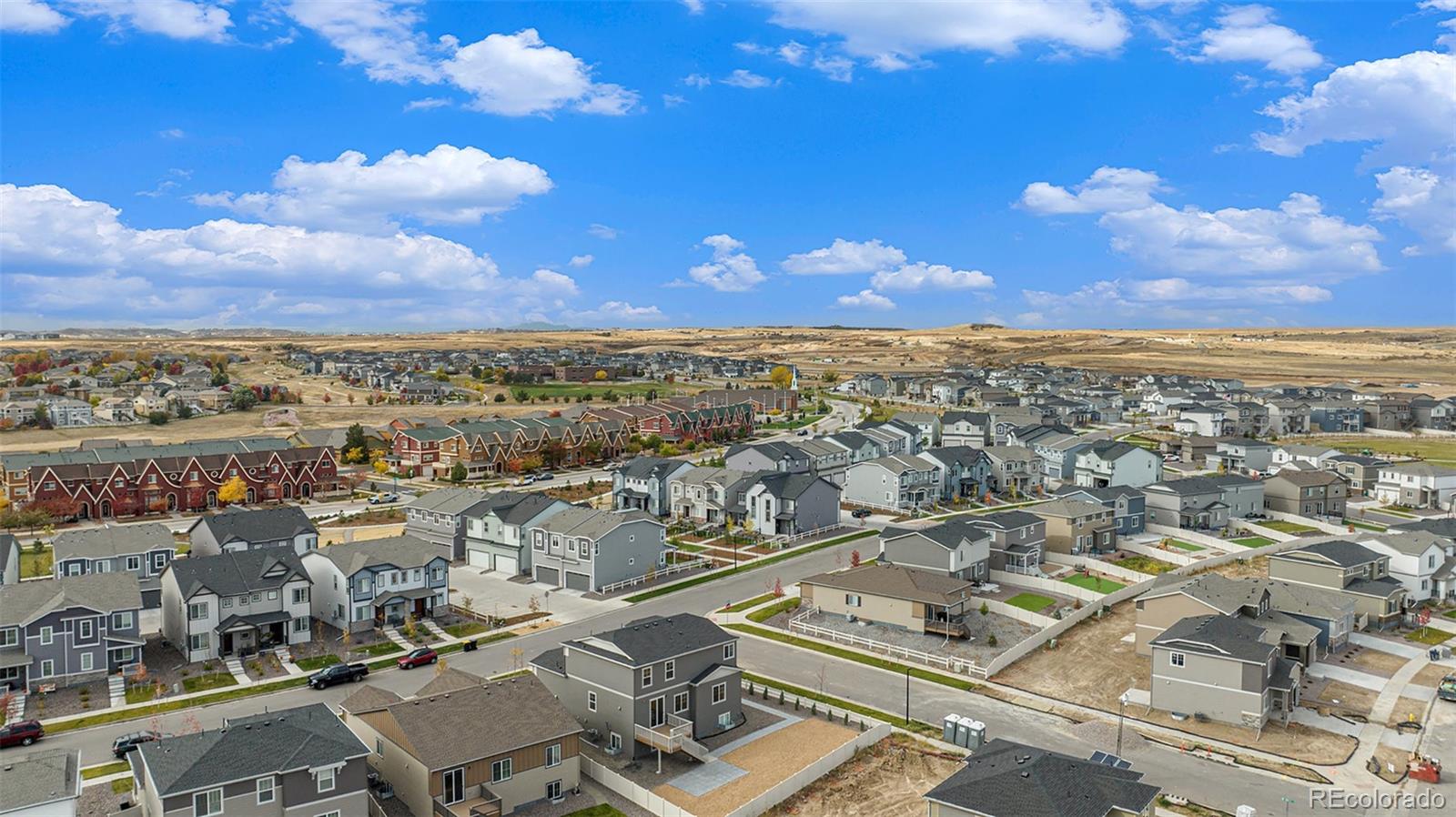 18235 Caffey Drive Parker, CO 80134 - Photo 34 of 38 an aerial view of residential building with green space