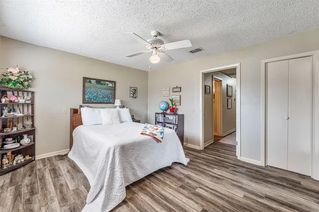 a bedroom with bed and a chandelier