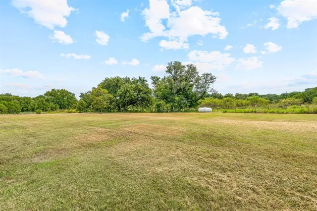 a view of a playground with basketball court