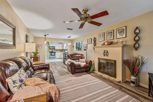 a bedroom with furniture and a fireplace
