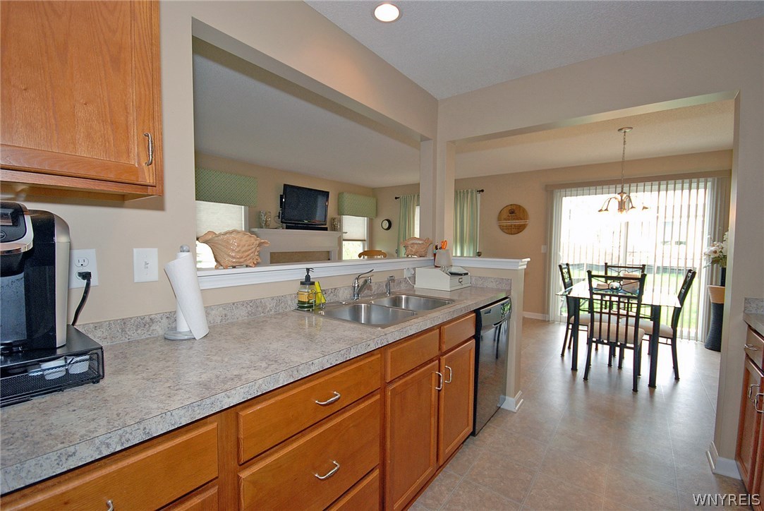 65 Hanover Street Lancaster, NY 14086 - Photo 11 of 25 Kitchen with dining room. Sliding doors in dining