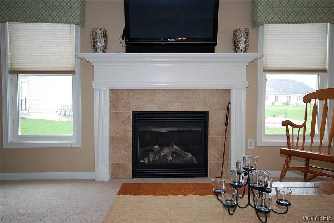 65 Hanover Street Lancaster, NY 14086 - Photo 7 of 25 Gas fireplace in living room