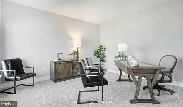 a view of a workspace with furniture