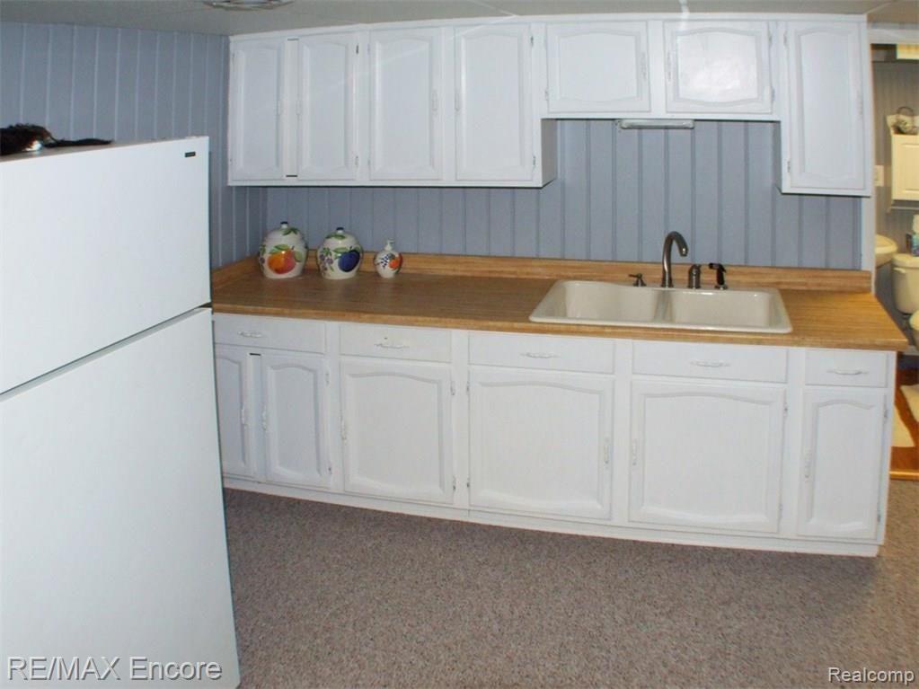 9965 Bridge Lake Road Clarkston, MI 48348 - Photo 26 of 34 In Law suite kitchen with double sink