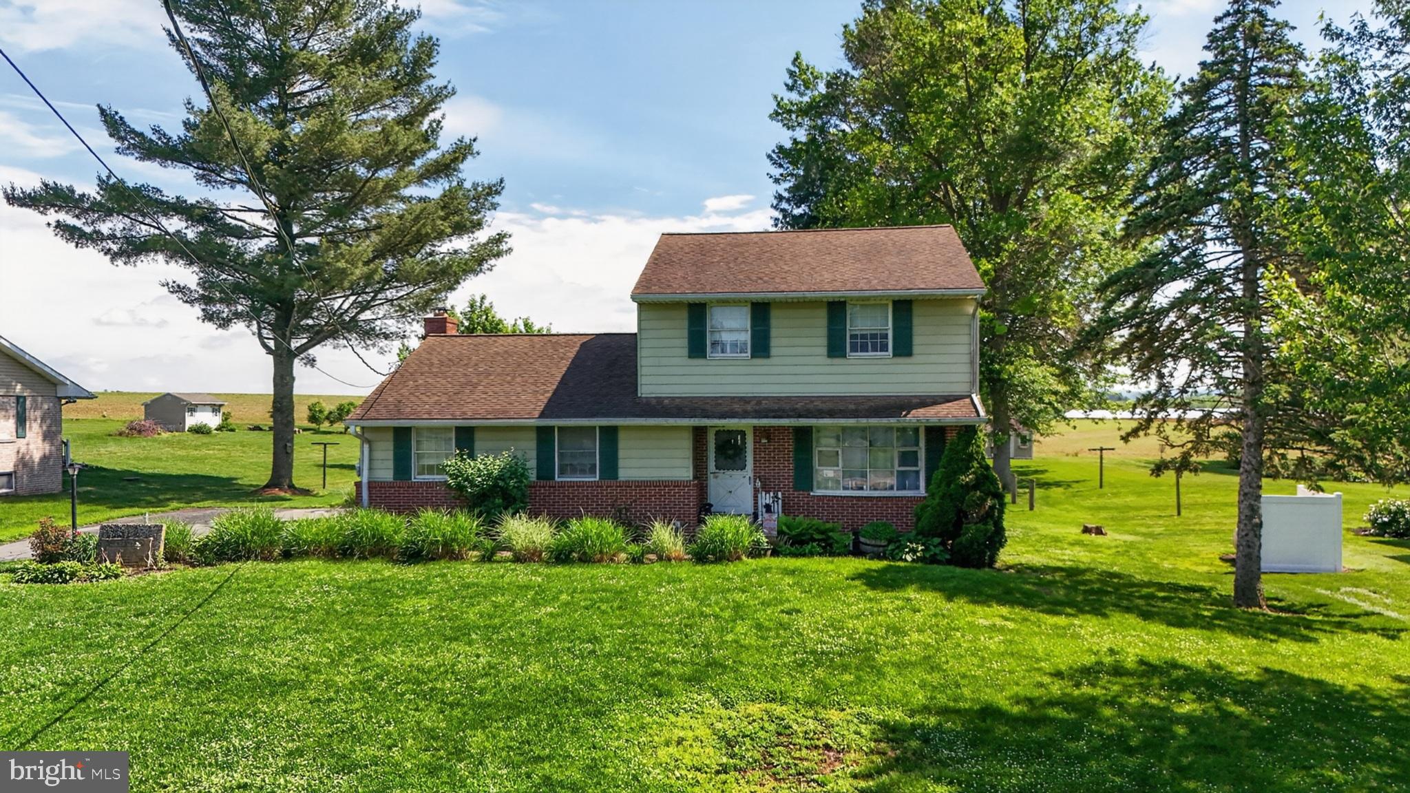 1106 Village Road Lancaster, PA 17602 - Photo 3 of 42 Charming home amidst lush greenery.