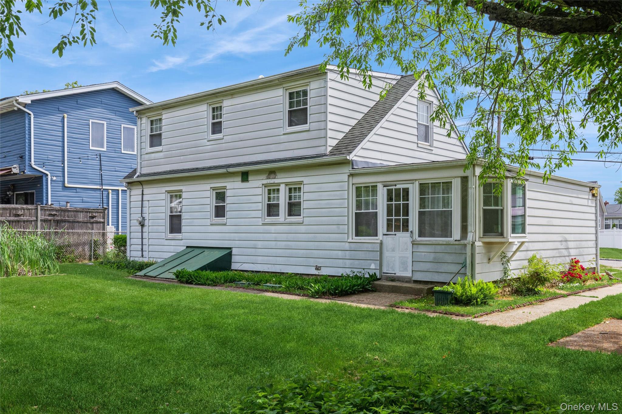10 Laurel Road Ronkonkoma, NY 11779 - Photo 2 of 21 a view of a house with a backyard