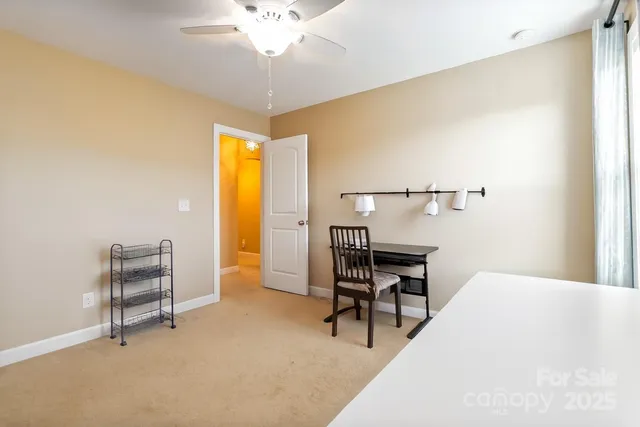 a view of dining room with furniture and a window