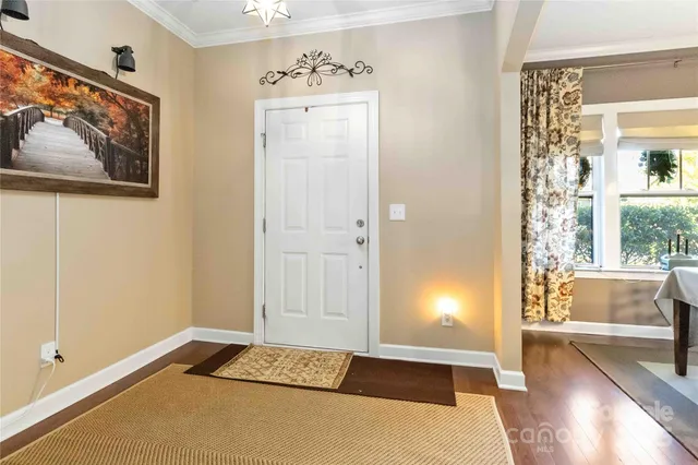 a view of an entryway with wooden floor
