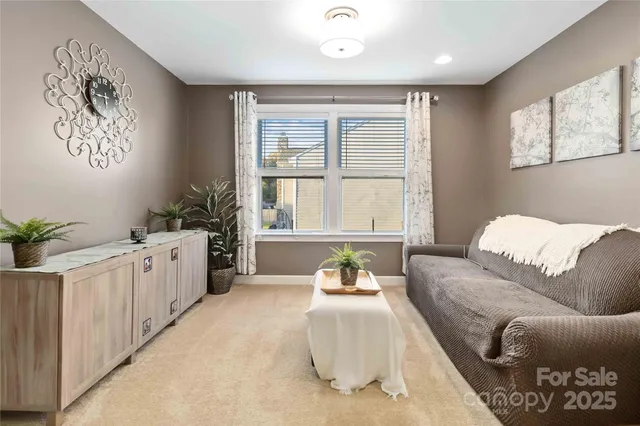 a spacious bedroom with a bed and a couch