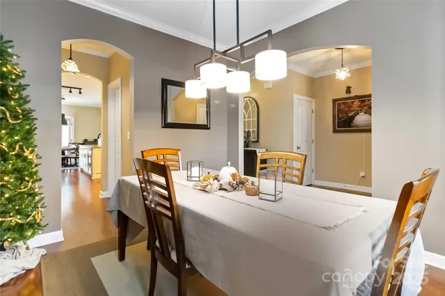 a dining room with a table and chairs