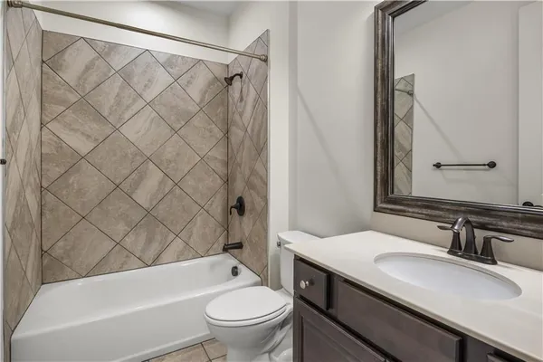 a bathroom with a sink a toilet and a bathtub