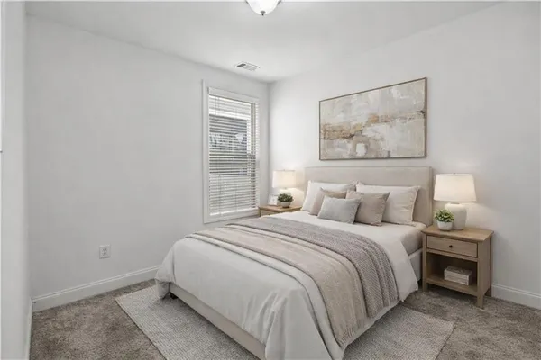 a view of a kitchen with stainless steel appliances a refrigerator and a wooden floor