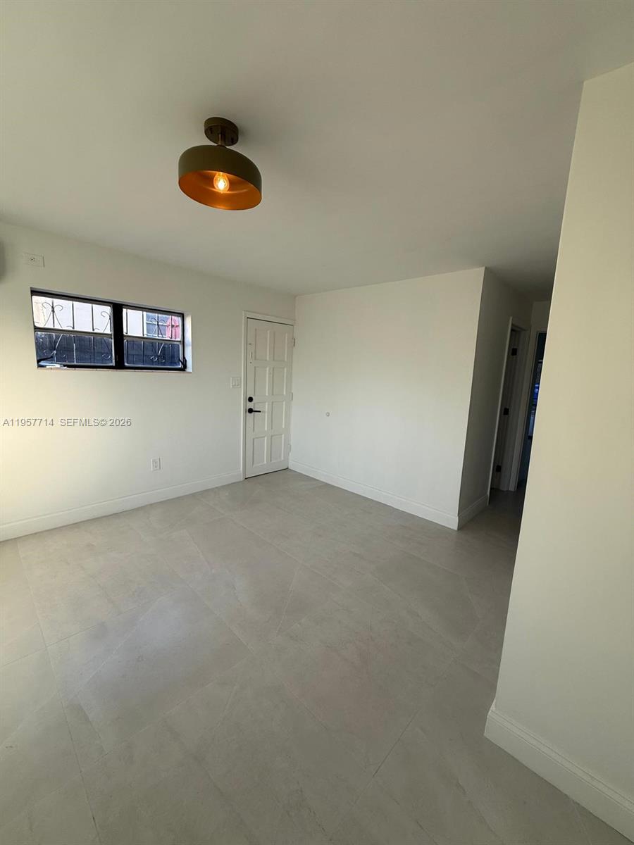 525 Southwest 22nd Avenue, Unit B Miami, FL 33135 - Photo 7 of 13 a view of an empty room