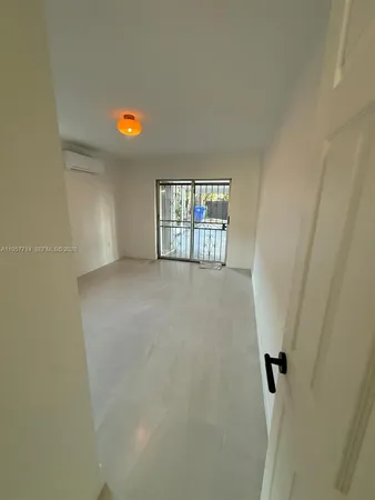 a view of a room with window and stairs