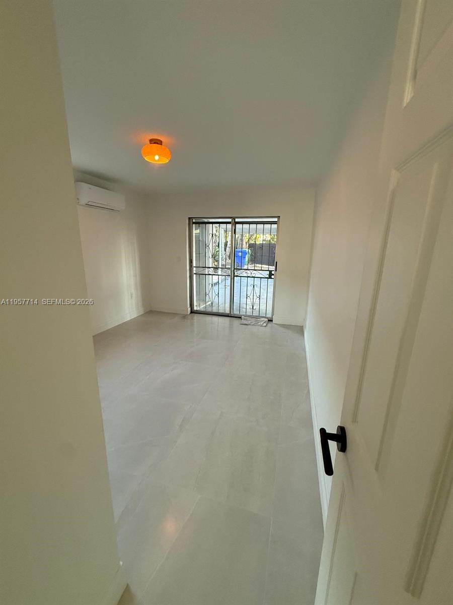 525 Southwest 22nd Avenue, Unit B Miami, FL 33135 - Photo 8 of 13 a view of a room with window and stairs