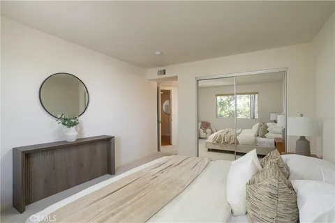 a bedroom with bed and a window