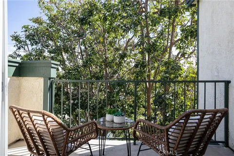 a view of a chairs and table in the patio