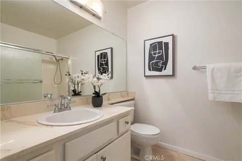 a bathroom with a sink toilet and vanity