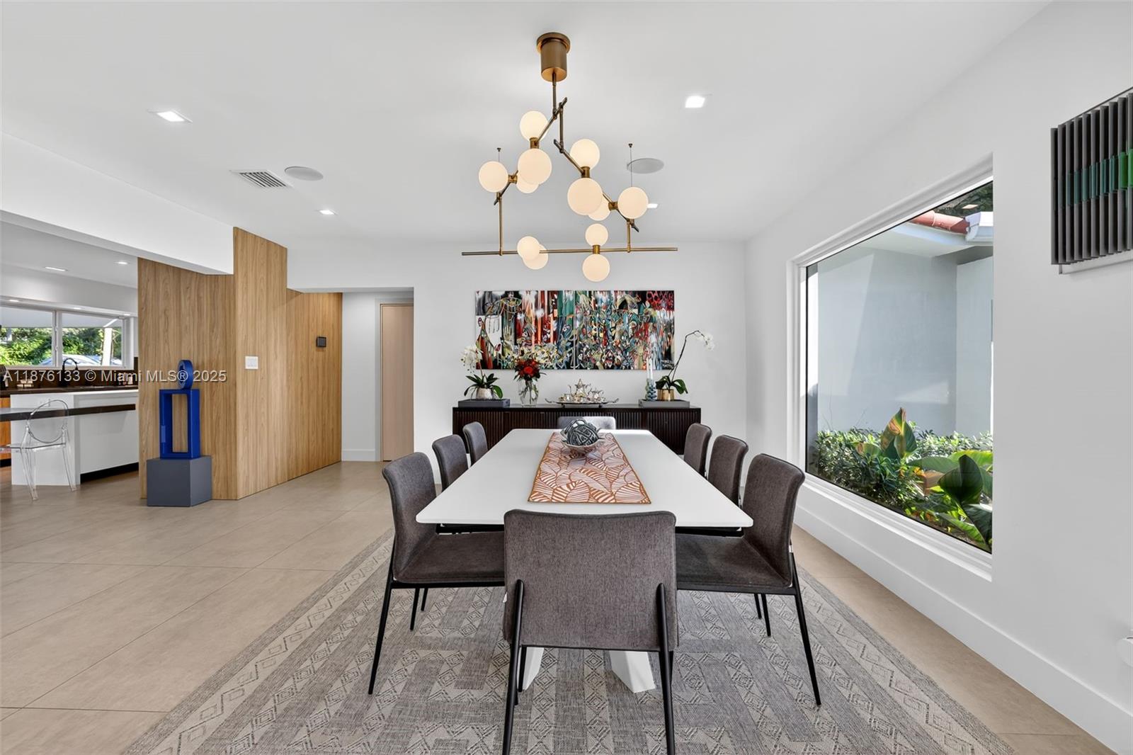 10740 Southwest 73rd Court Pinecrest, FL 33156 - Photo 11 of 37 a view of a dining room with furniture and wooden floor
