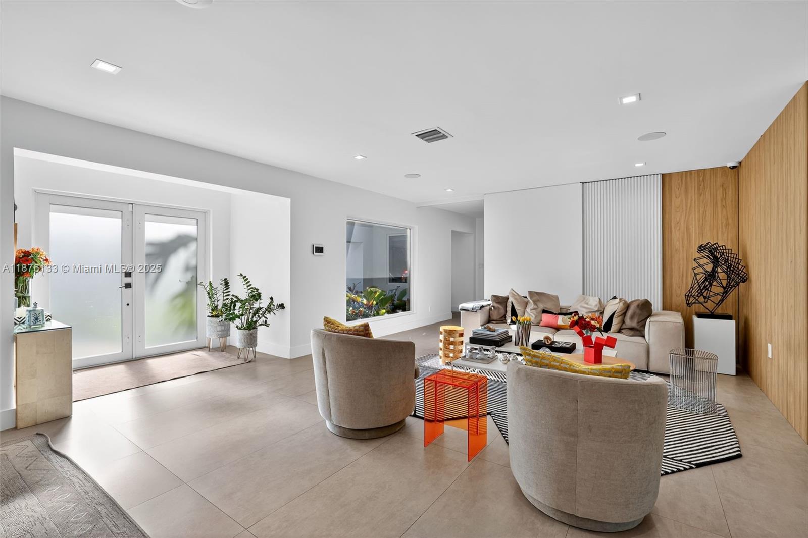 10740 Southwest 73rd Court Pinecrest, FL 33156 - Photo 2 of 37 a living room with furniture