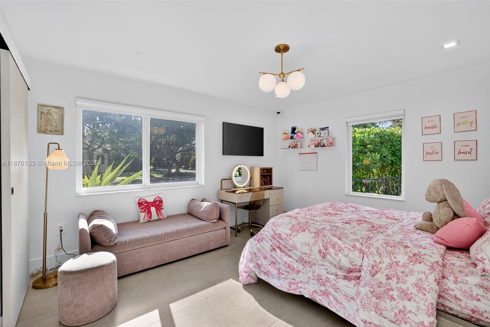 10740 Southwest 73rd Court Pinecrest, FL 33156 - Photo 23 of 37 a bedroom with a bed and wooden floor