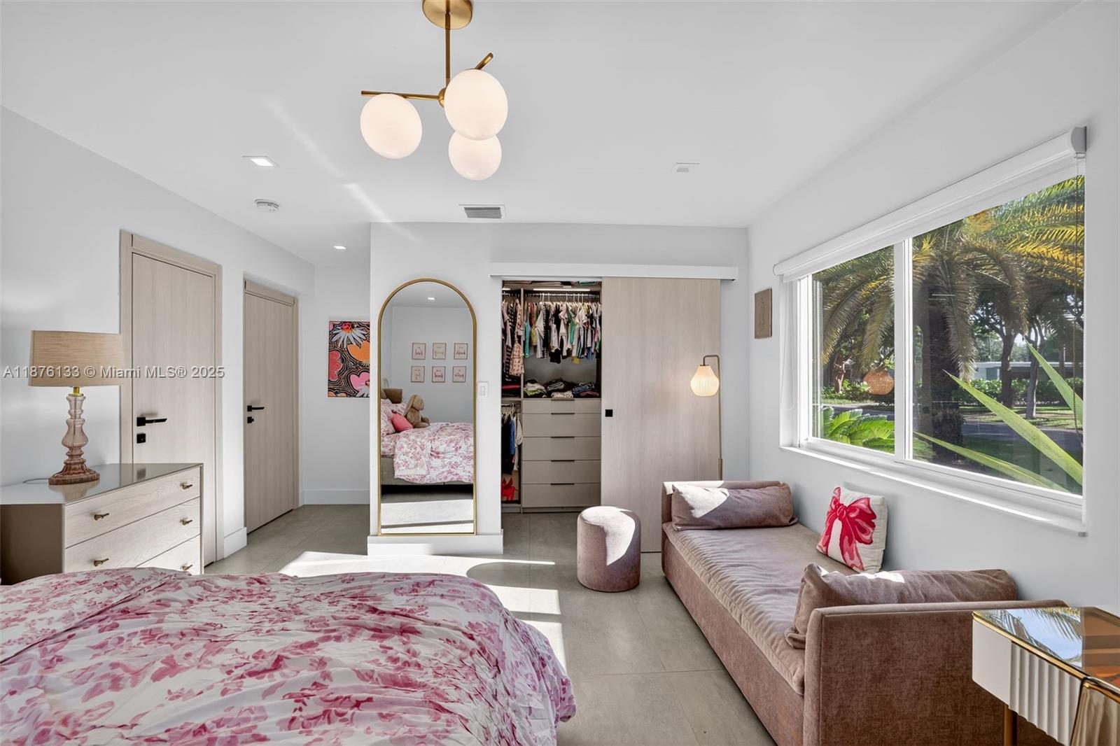 10740 Southwest 73rd Court Pinecrest, FL 33156 - Photo 24 of 37 a living room with furniture and window
