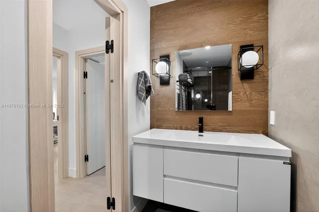 a bathroom with a sink and a mirror