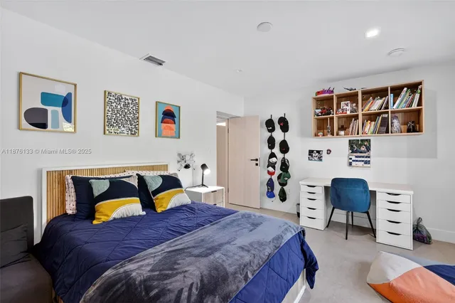 a bedroom with a bed and cabinets