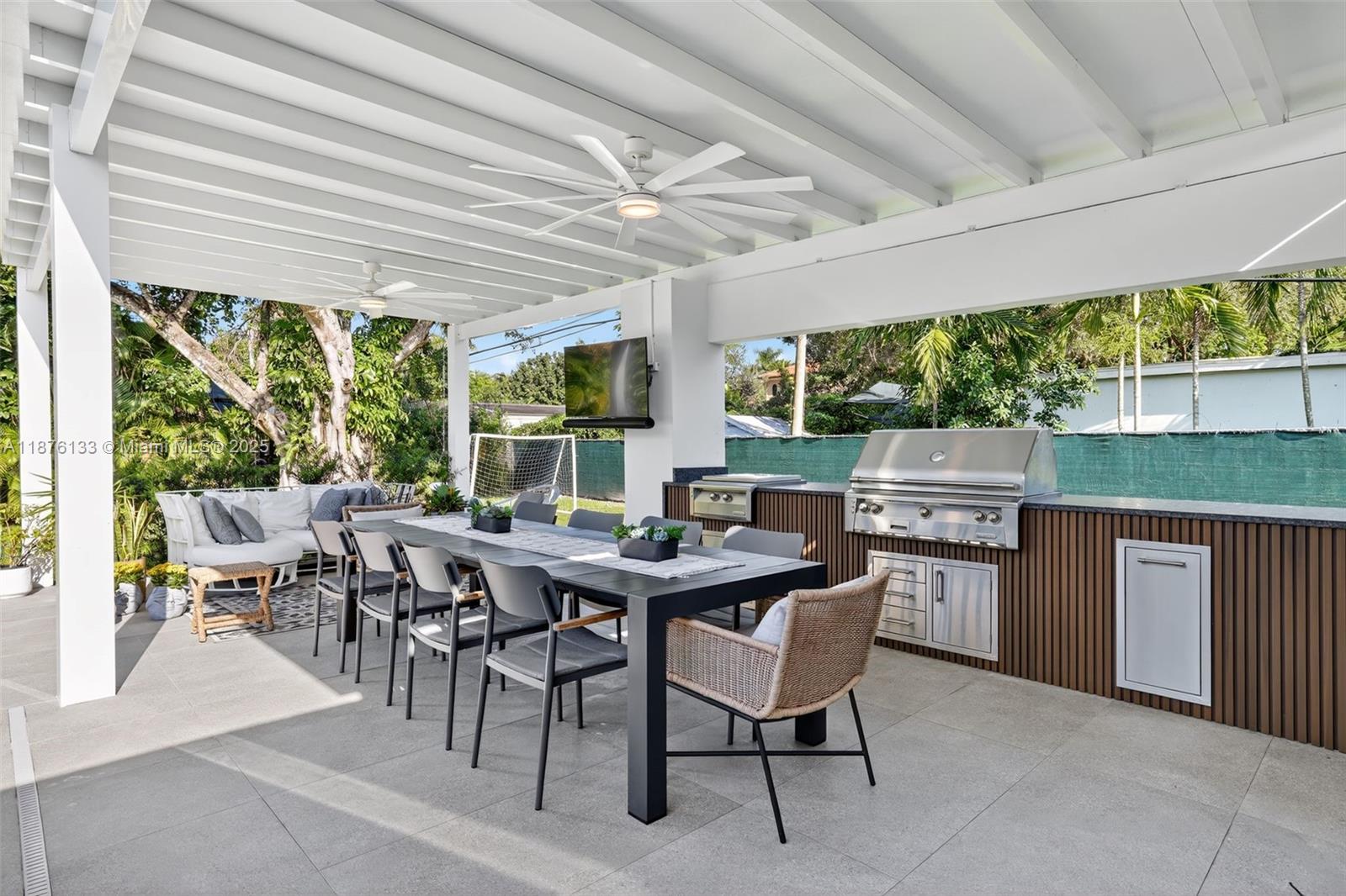 10740 Southwest 73rd Court Pinecrest, FL 33156 - Photo 30 of 37 a view of a dining room with furniture window and outside view