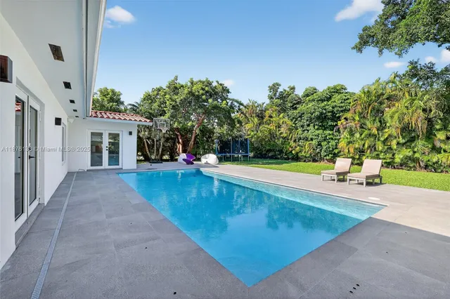 a view of swimming pool with an outdoor space and seating area