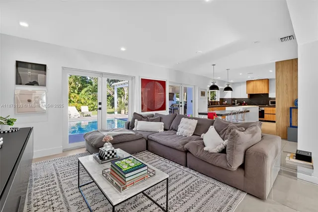 a living room with furniture and a rug