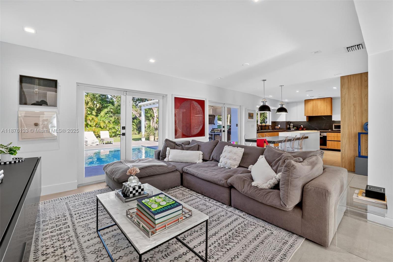 10740 Southwest 73rd Court Pinecrest, FL 33156 - Photo 5 of 37 a living room with furniture and a rug