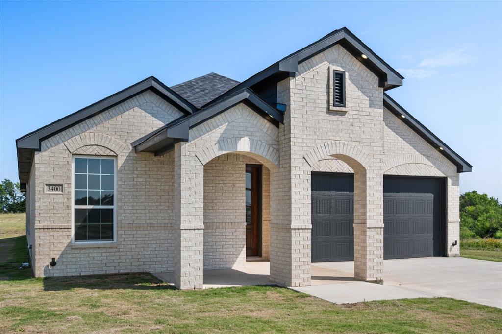 3400 Dobbins Road Corsicana, TX 75110 - Photo 39 of 40 a front view of a house with a yard