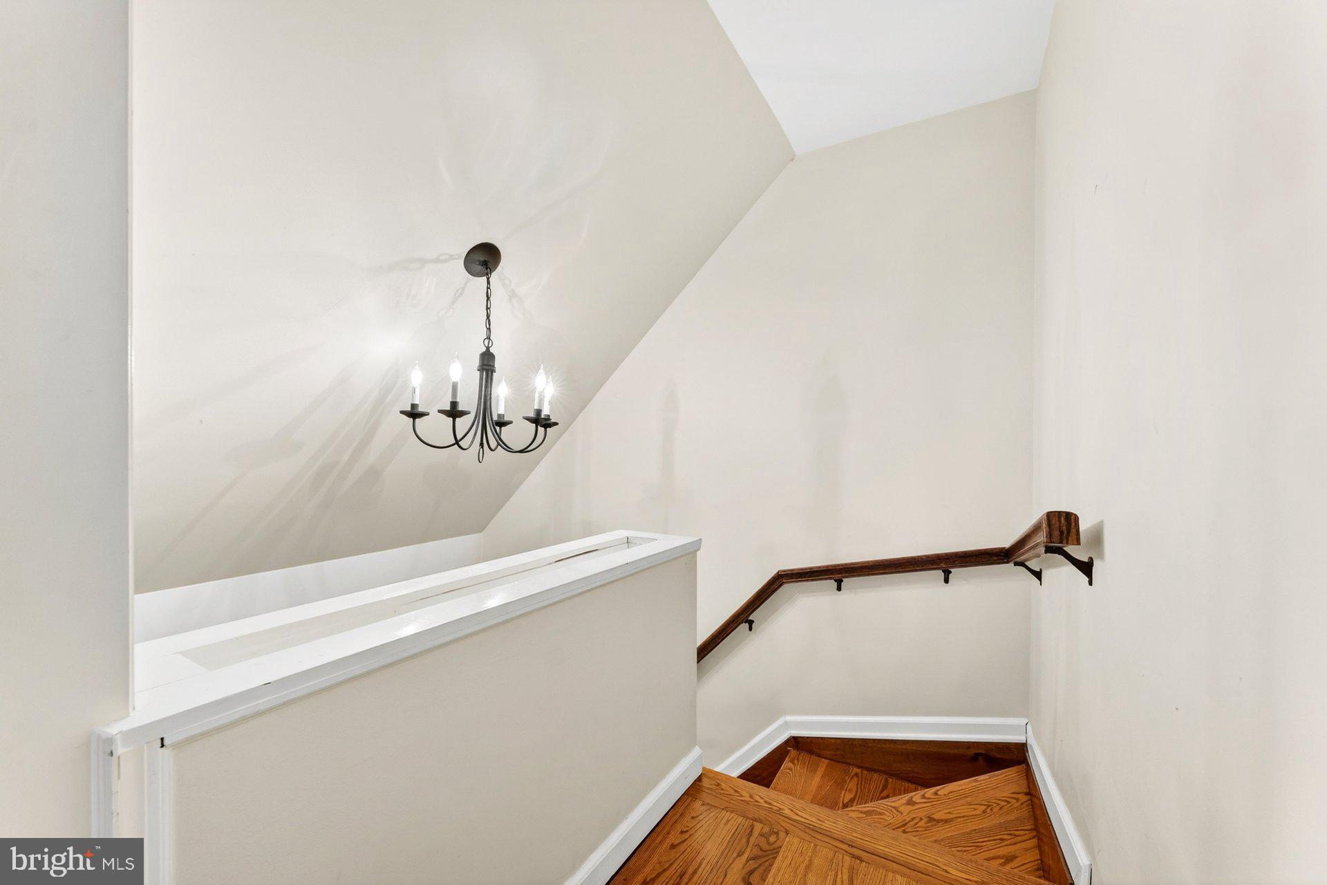 69 Manners Road Ringoes, NJ 08551 - Photo 32 of 42 Elegant staircase with chandelier glow.