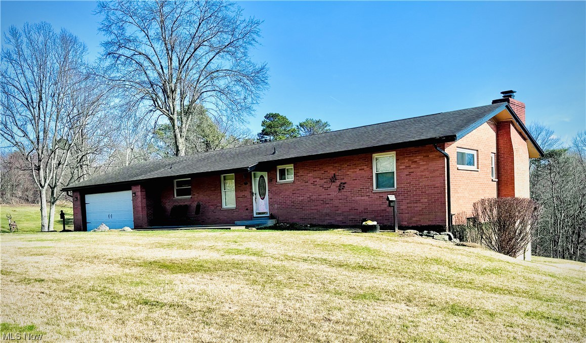 2361 Dutch Ridge Road Parkersburg, WV 26104 - Photo 2 of 17 Single story home featuring a front lawn and a garage