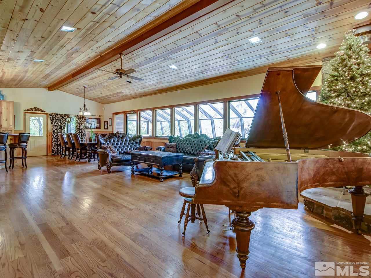 4125 Christy Way Reno, NV 89519 - Photo 1 of 23 a living room with furniture and a wooden floor