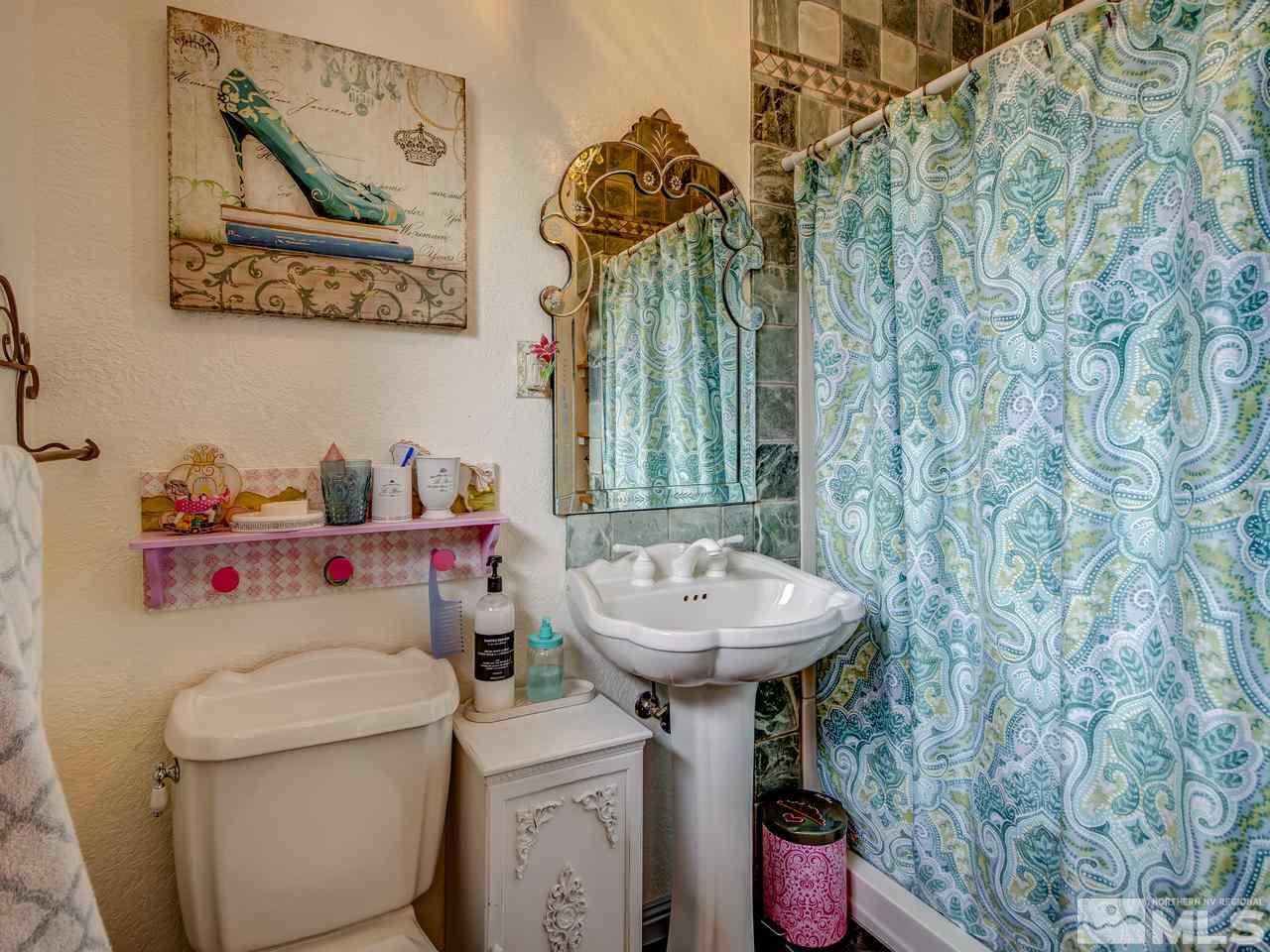 4125 Christy Way Reno, NV 89519 - Photo 11 of 23 a bathroom with a sink toilet and shower