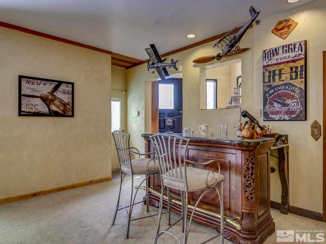 4125 Christy Way Reno, NV 89519 - Photo 15 of 23 a view of a dining room with furniture and chandelier
