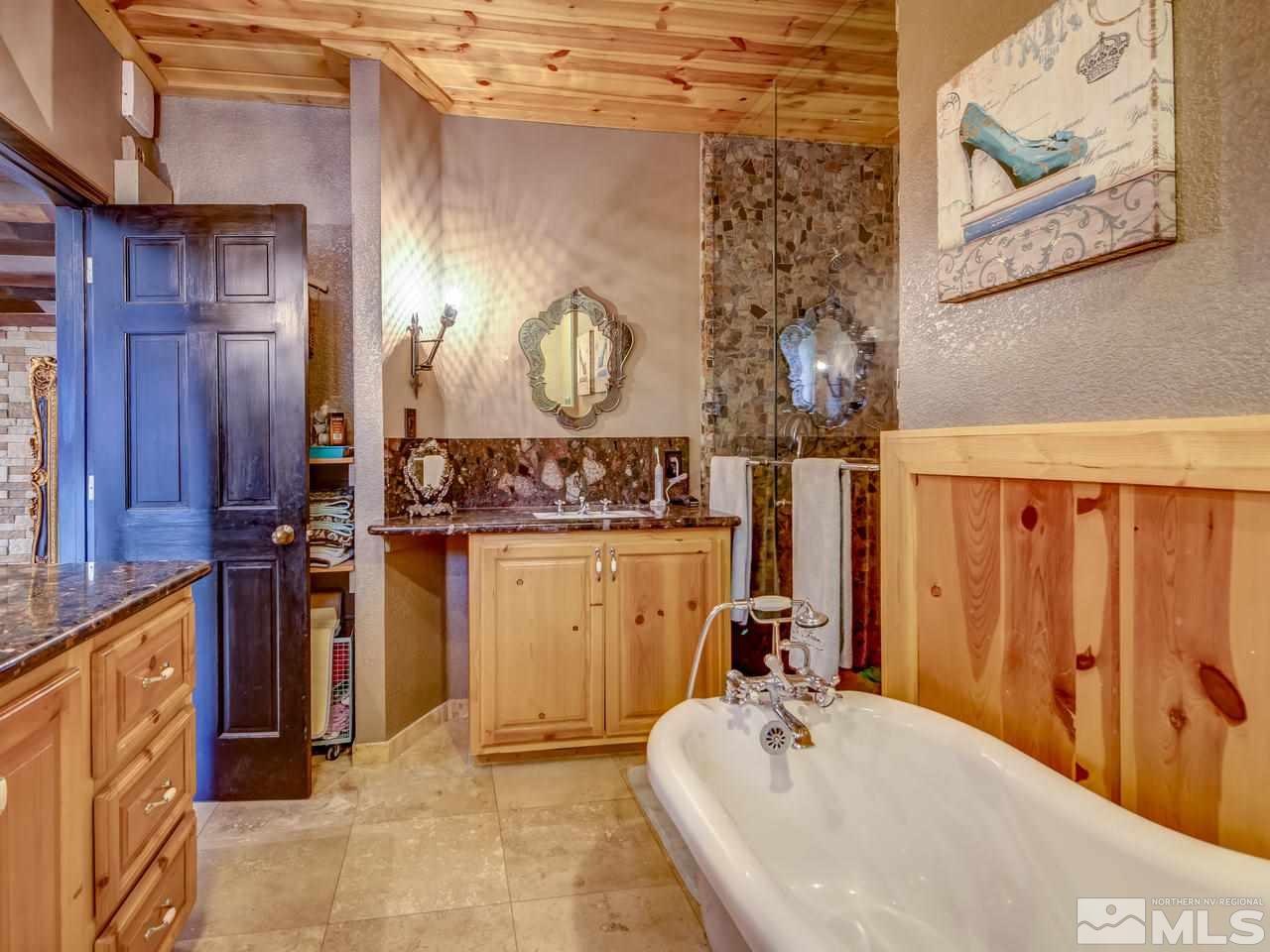 4125 Christy Way Reno, NV 89519 - Photo 7 of 23 a bathroom with a sink and mirror