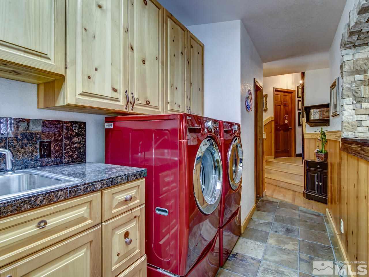 4125 Christy Way Reno, NV 89519 - Photo 9 of 23 a utility room with stainless steel appliances granite countertop a stove top oven