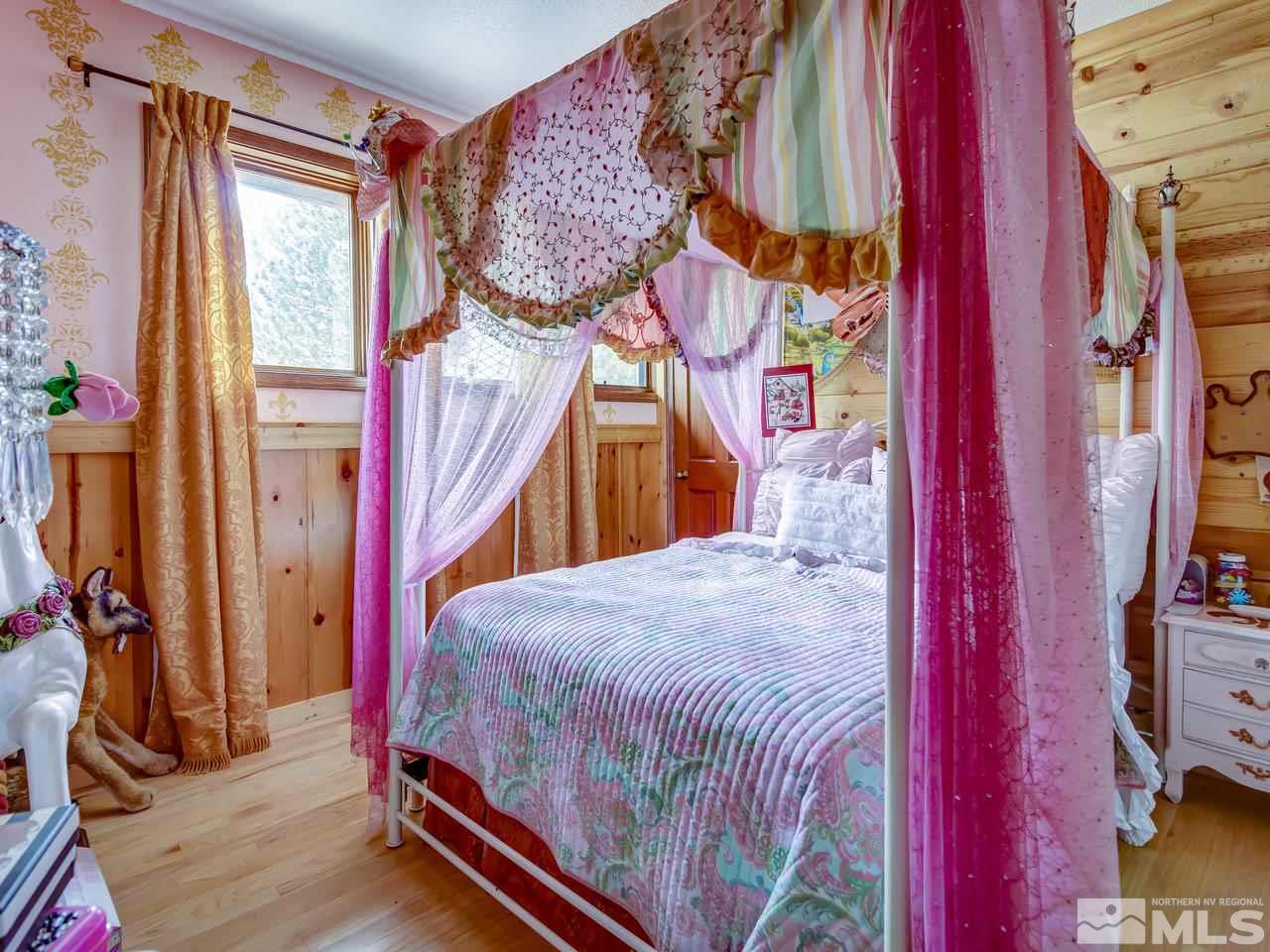 4125 Christy Way Reno, NV 89519 - Photo 10 of 23 a bedroom with a bed and a mirror