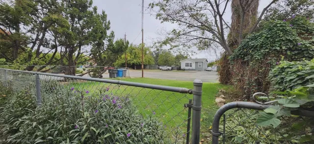 a view of a garden with a bench