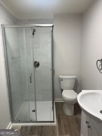 a bathroom with a shower and a toilet
