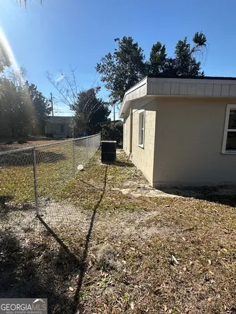a view of a backyard of the house
